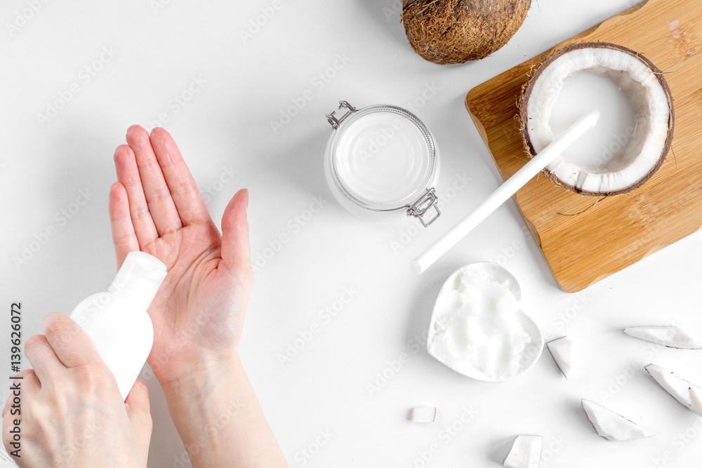 organic cosmetics with coconut on white background top view