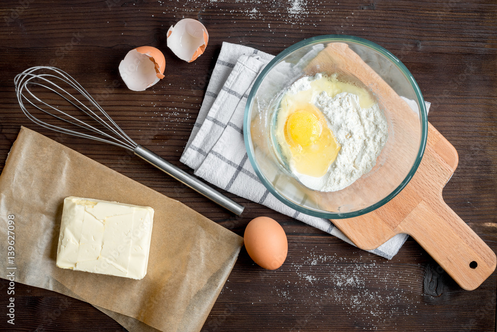 cooking pancake on wooden background top view ingredients for making