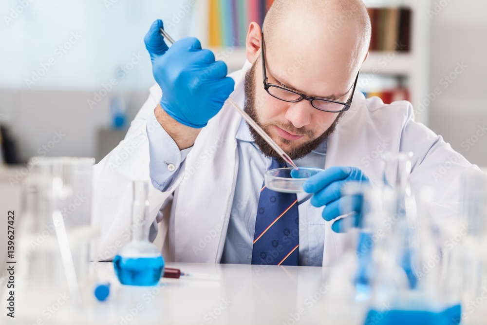 Man researcher carrying out scientific research.