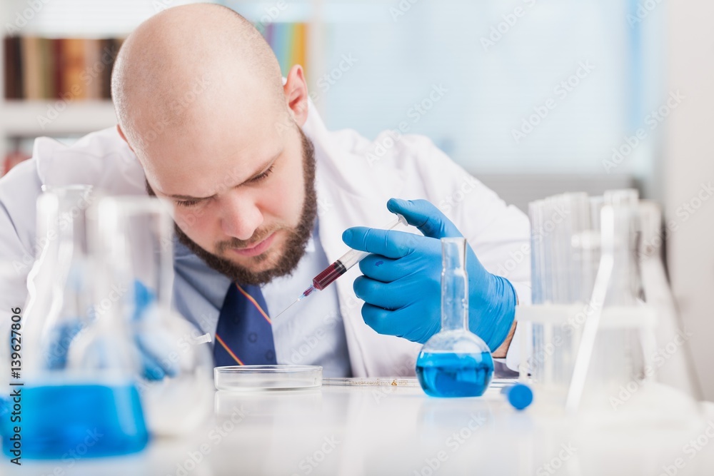 Man researcher carrying out scientific research.