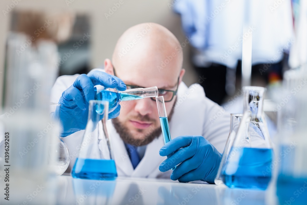 Man researcher carrying out scientific research.