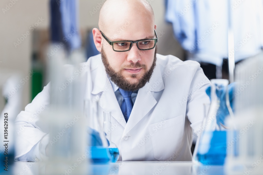 Man researcher carrying out scientific research.