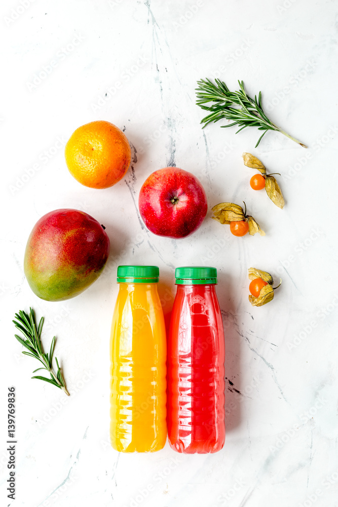 sweet juice in bottle with fruit on white background top view mockup