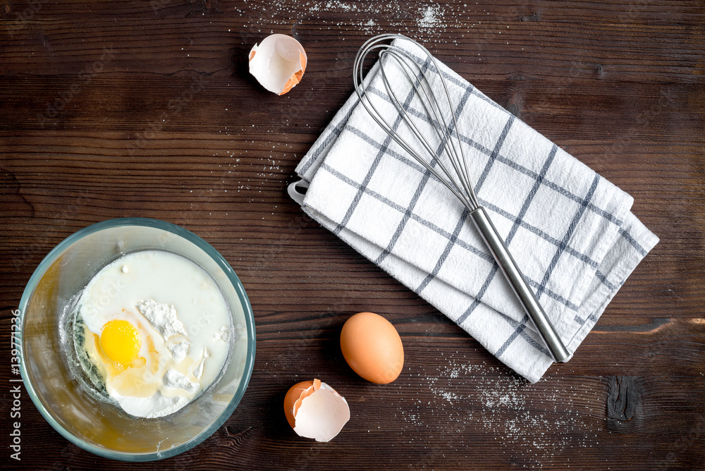 cooking pancake on wooden background top view ingredients for making