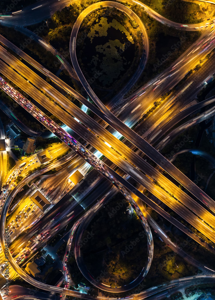 The light on the road  roundabout at night and the city in Bangkok, Thailand.Aerial view.Top view.Li