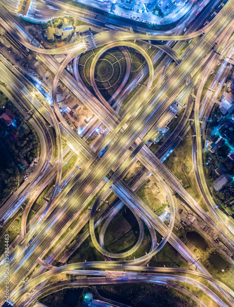 The light on the road  roundabout at night and the city in Bangkok, Thailand.Aerial view.Top view.Li