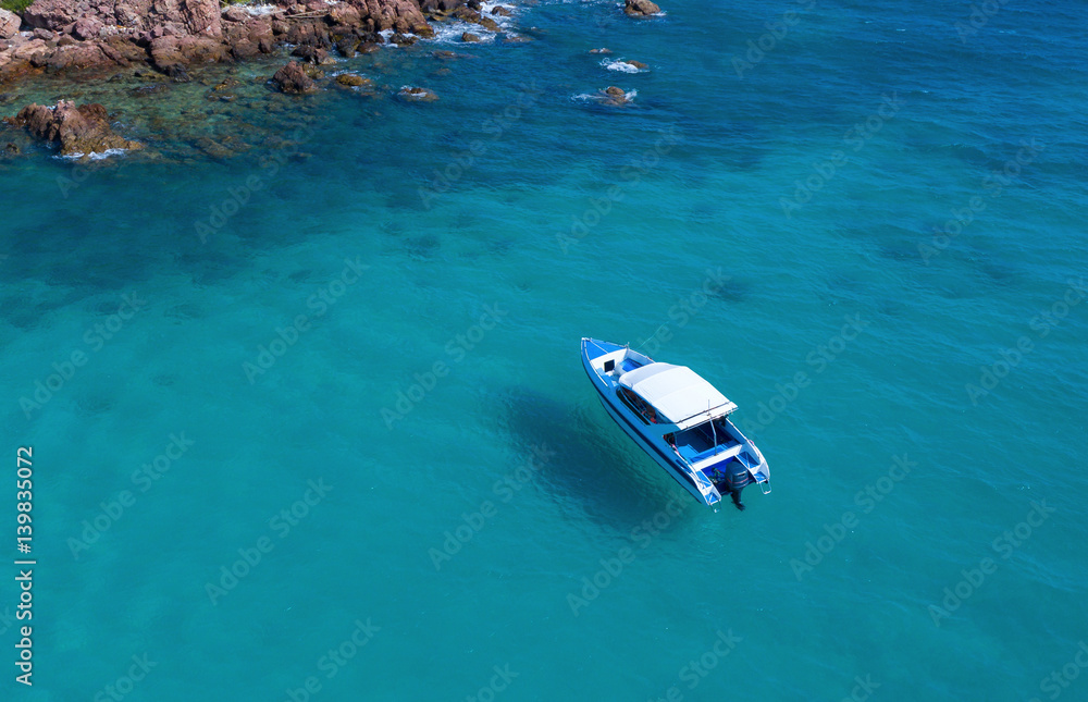 Speed boat in the sea.Aerial view. Top view.amazing nature background.The color of the water and bea