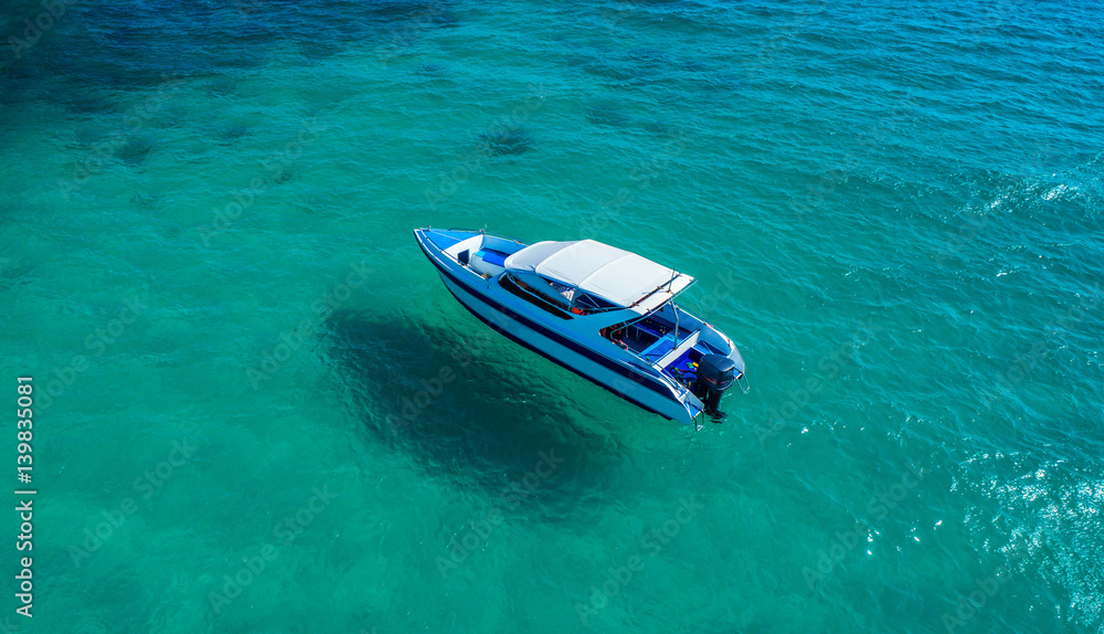 Speed boat in the sea.Aerial view. Top view.amazing nature background.The color of the water and bea