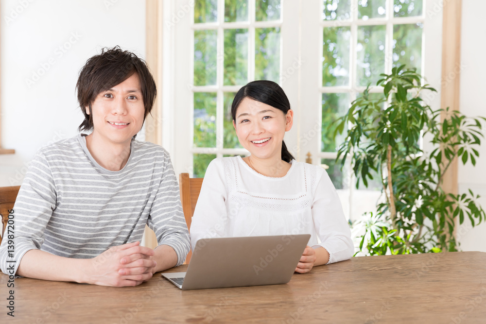 young asian couple using laptop computer