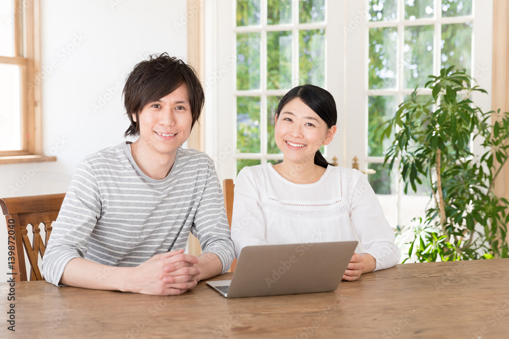 young asian couple using laptop computer