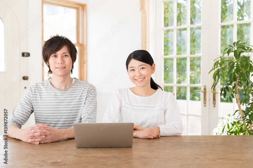 young asian couple using laptop computer