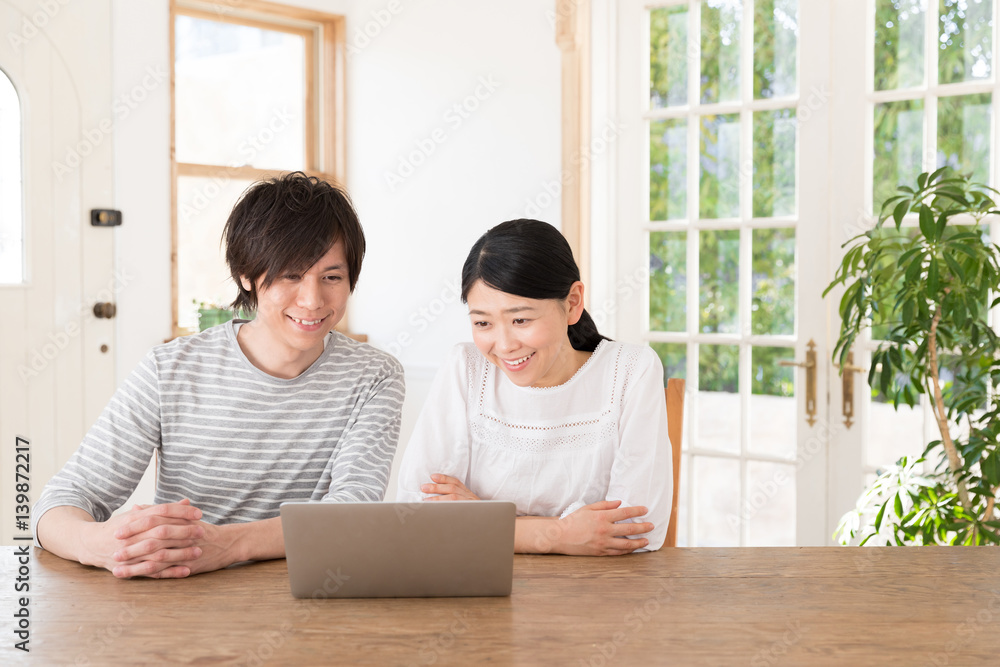 young asian couple using laptop computer