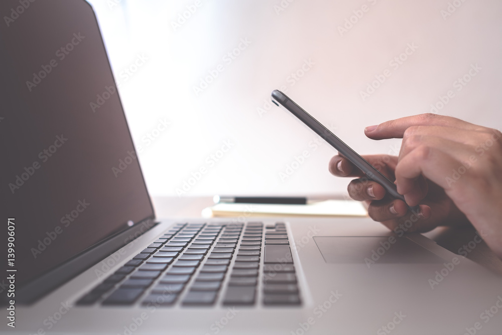 Female using smart phone during working time in office