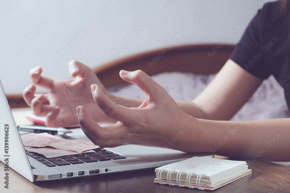 Angry woman in front of laptop during working