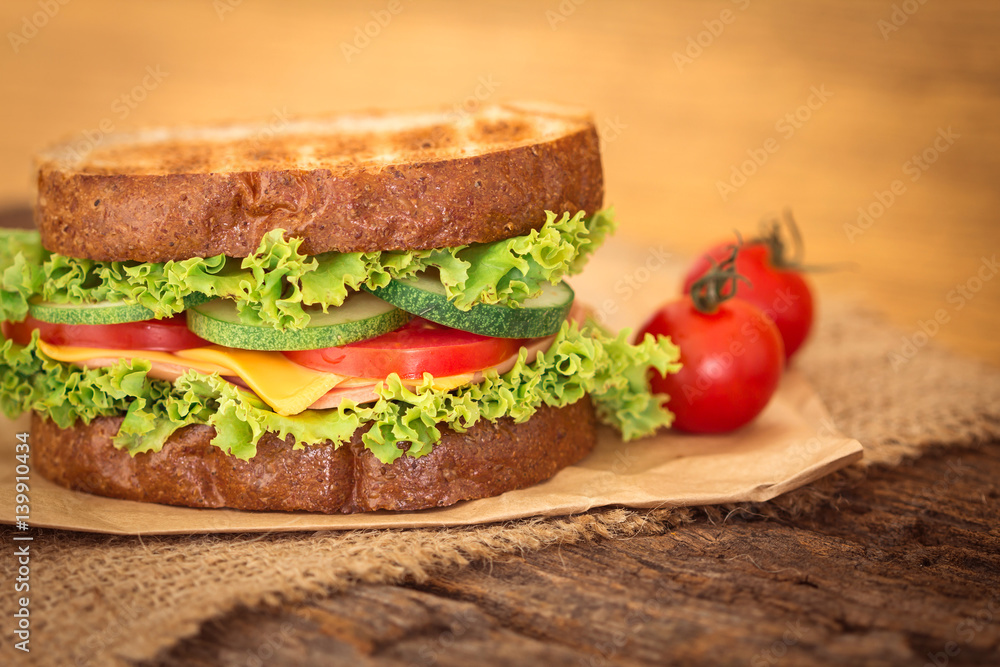 Grilled sandwiches bread with bacon , ham and cheese with vegetable , healthy breakfast