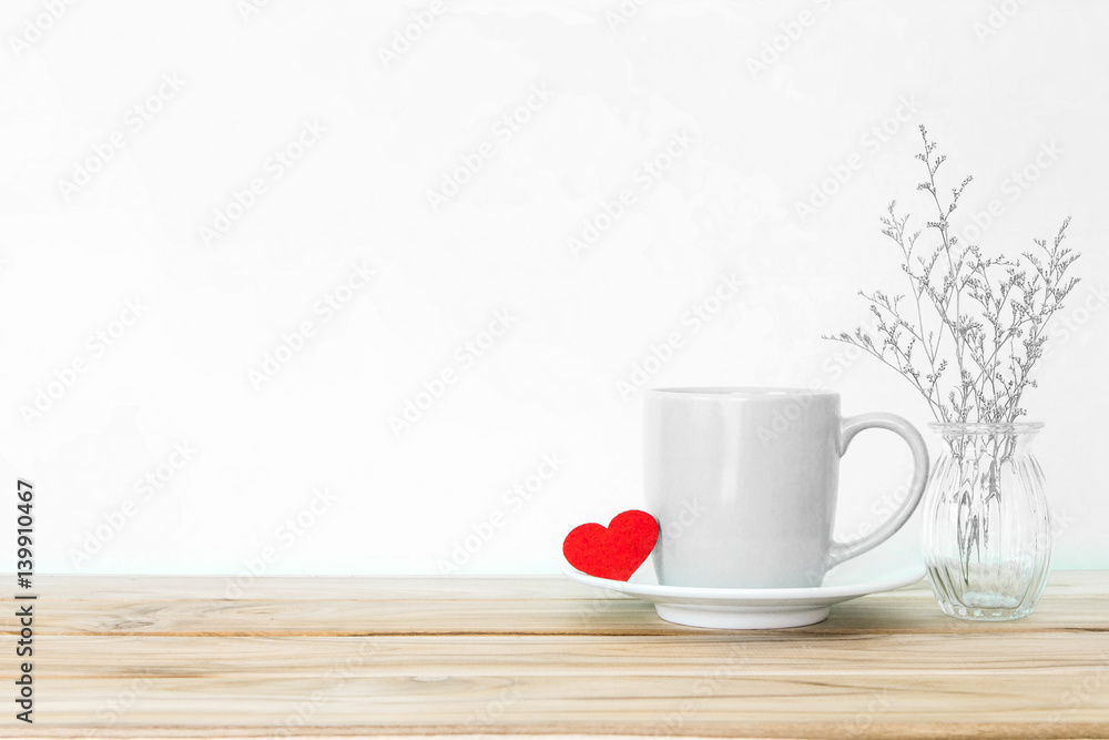 Coffee cup mug with red heart shape on wooden table , Romance and love valentines day background con