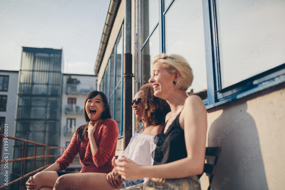 Young female friends enjoying in terrace