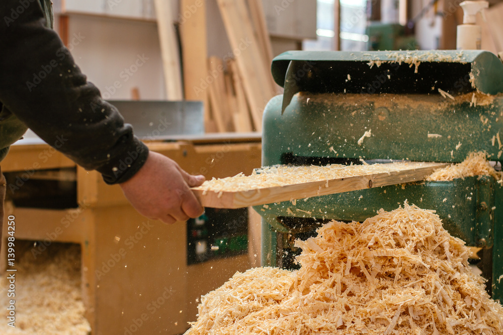 Craftsman working in his workspace. Working with wood