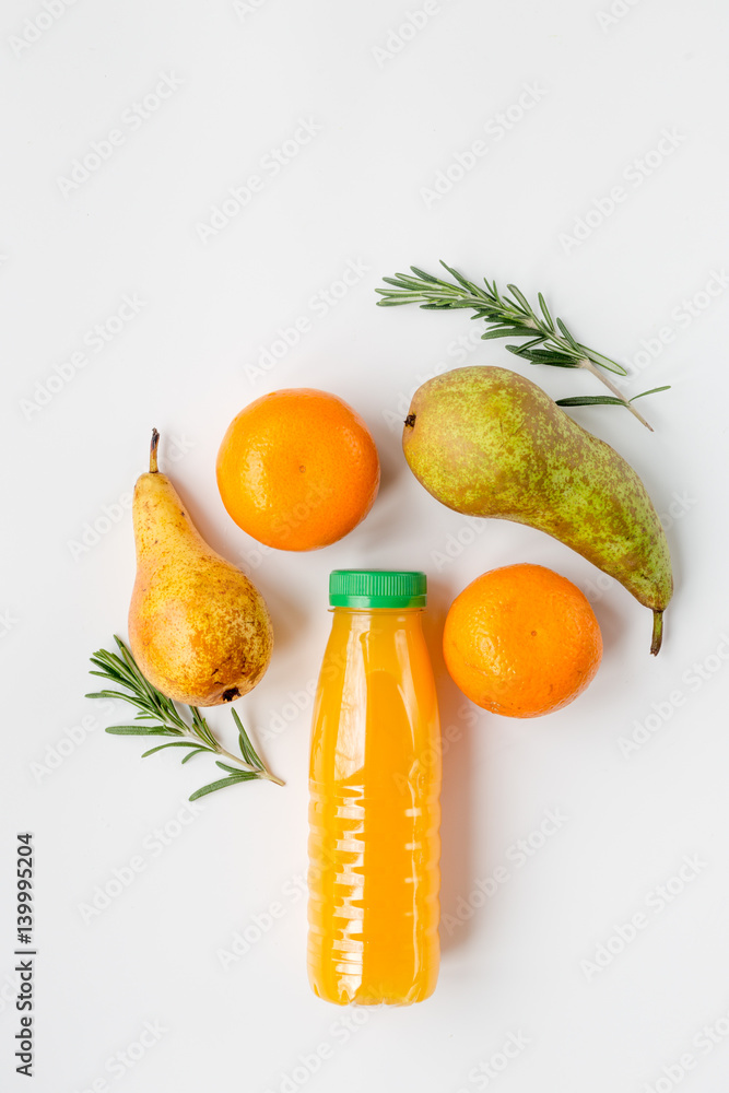 colorful plastic bottle with fruit on white background top view mock up