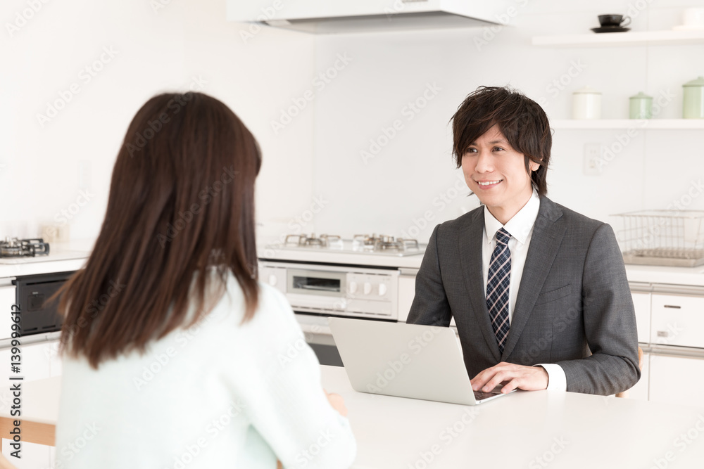 asian businessman talking in kitchen