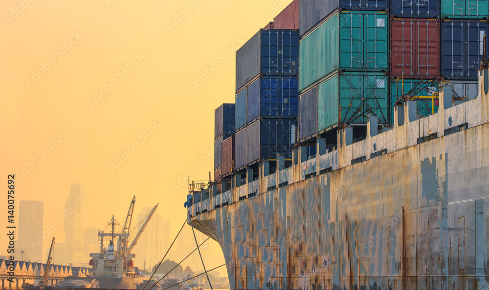 container ship in import export and business logistic.By crane ,Trade Port , Shipping.cargo to harbo