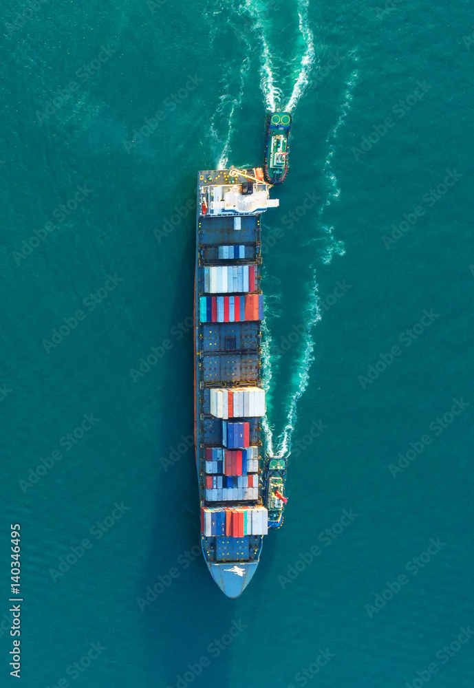 container ship in import export and business logistic.By crane ,Trade Port , Shipping.cargo to harbo