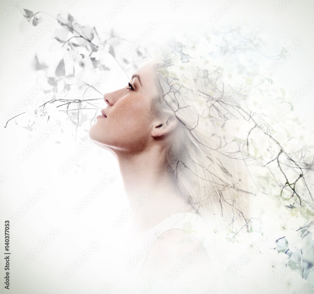 Double exposure of young woman and dogwood flowers