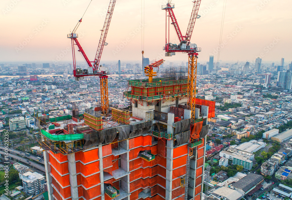 Construction site with cranes. Construction workers are building.Aerial view.Top view.