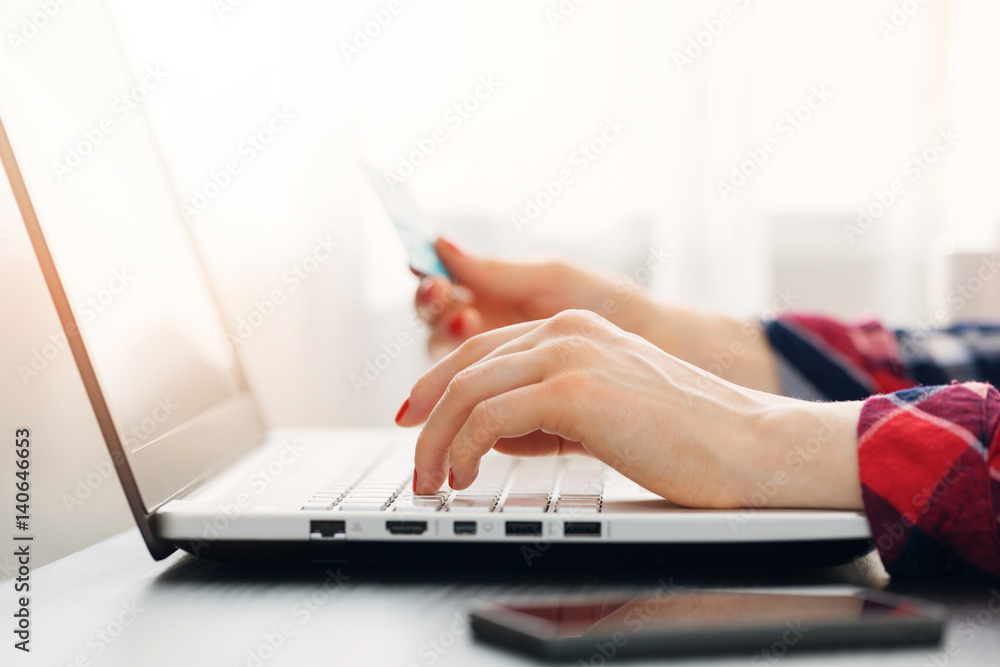 woman making online payment with credit card