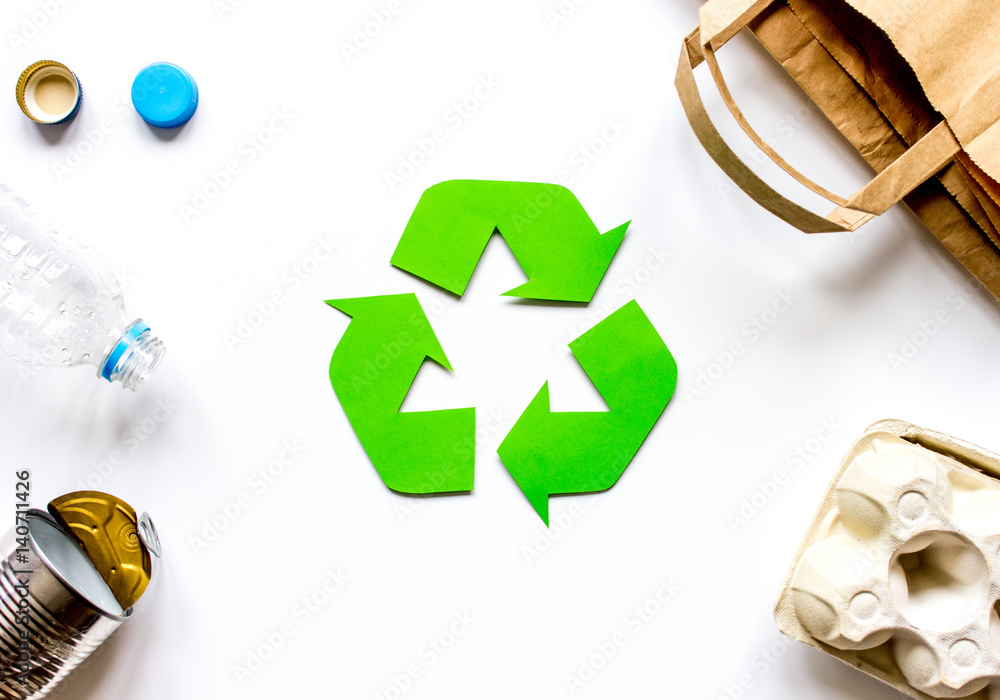 Eco concept with recycling symbol on table background top view mock up