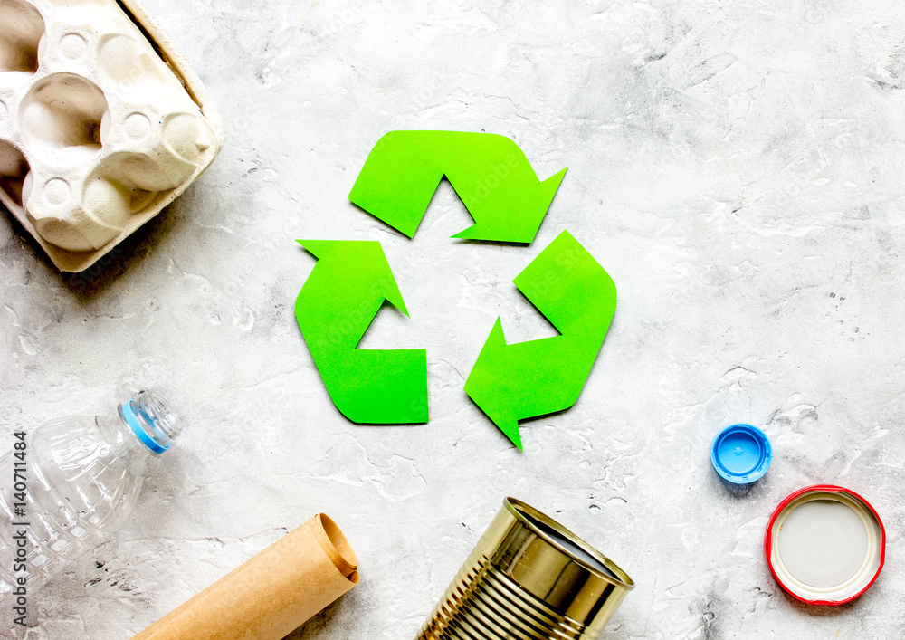 environment concept with recycling symbol on stone background top view mock-up