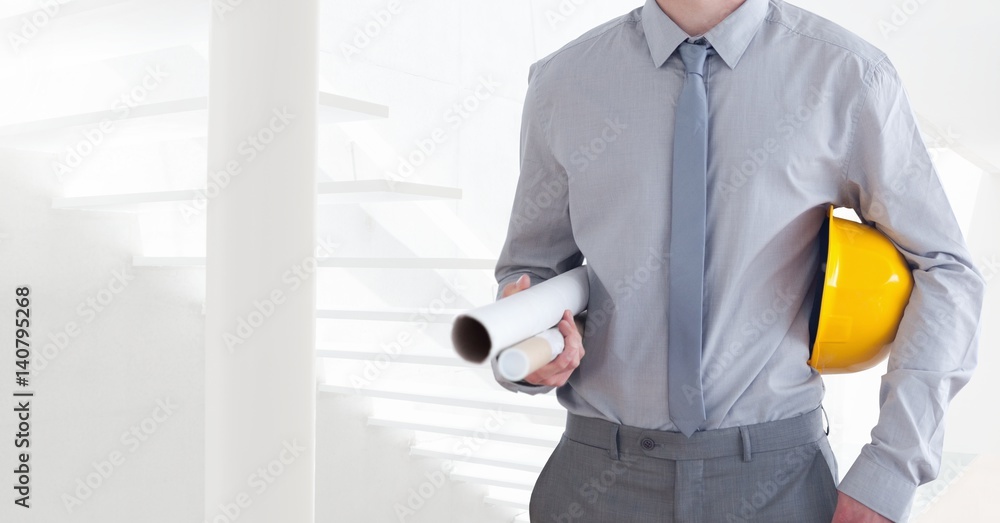 Architect Torso holding a cask and plan in front of steps