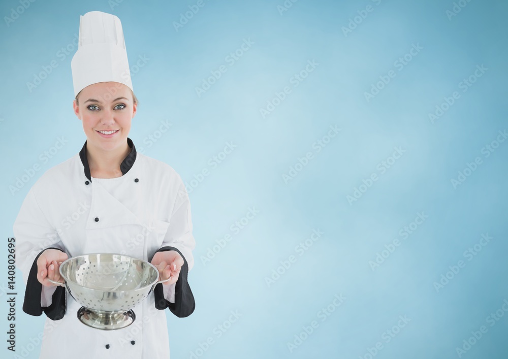 Chef with sieve against blue background