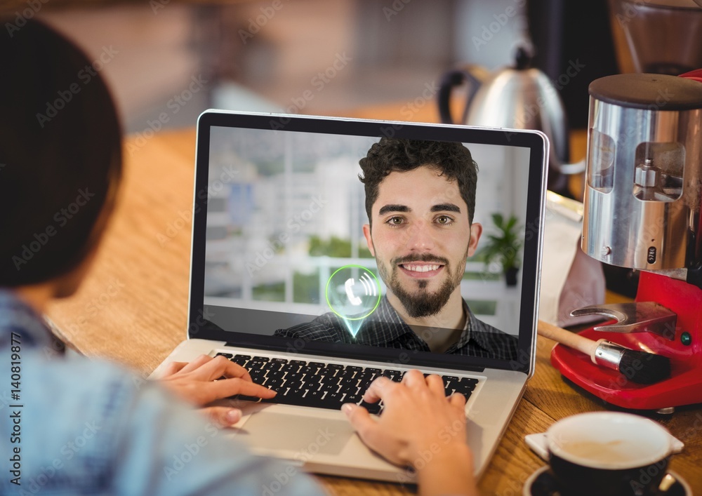 Female executive having video calling with colleague on laptop