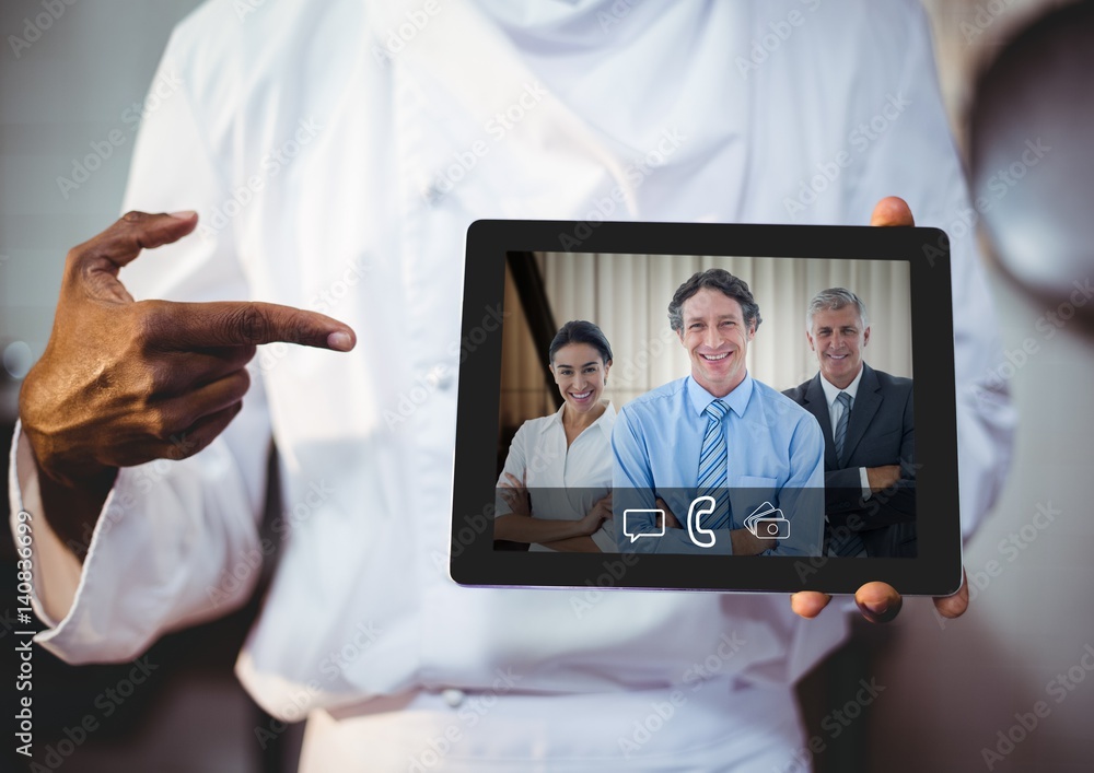 Businessman having video call with colleagues on digital tablet