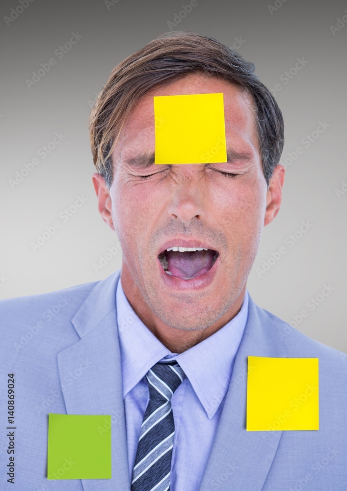 Businessman with blank sticky notes stuck on his face