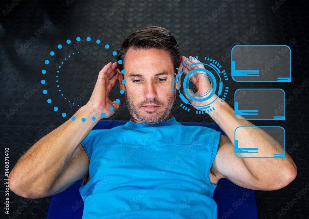 Man exercising against digital interface at gym