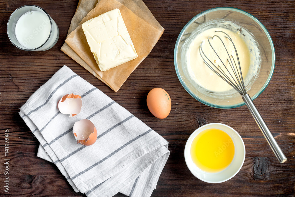 cooking pancake on wooden background top view ingredients for making