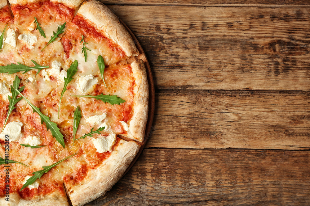 Fresh pizza Four Cheese on wooden background