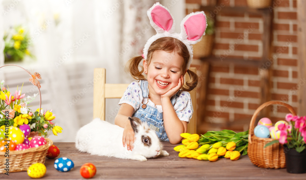 happy easter! happy funny child girl playing with bunny