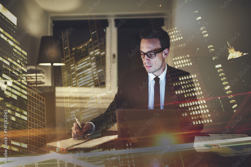 Serious concentrated businessman working at office