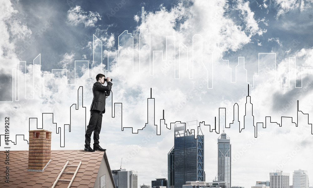 Businessman standing on roof and looking in binoculars. Mixed me