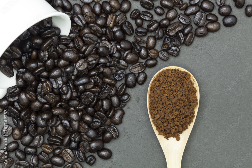 coffee beans on dark black background.