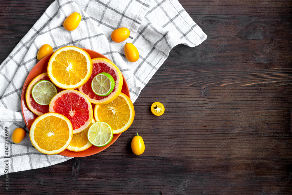 sliced citrus fruits on kitchen background top view mockup