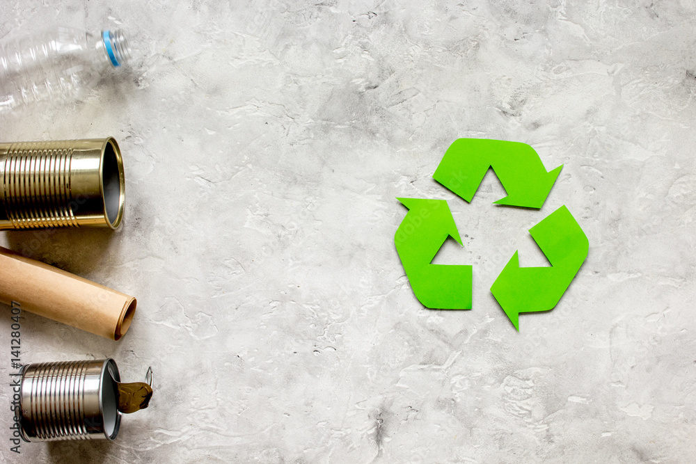 environment concept with recycling symbol on stone background top view mock-up