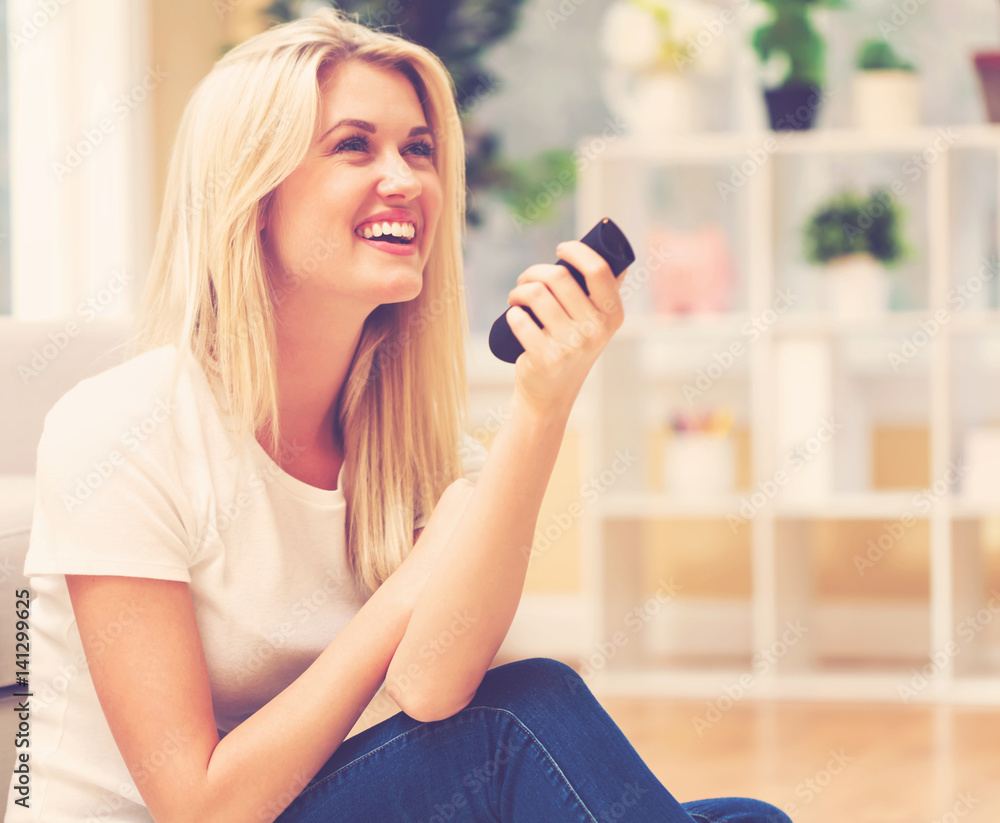 Young woman watching TV