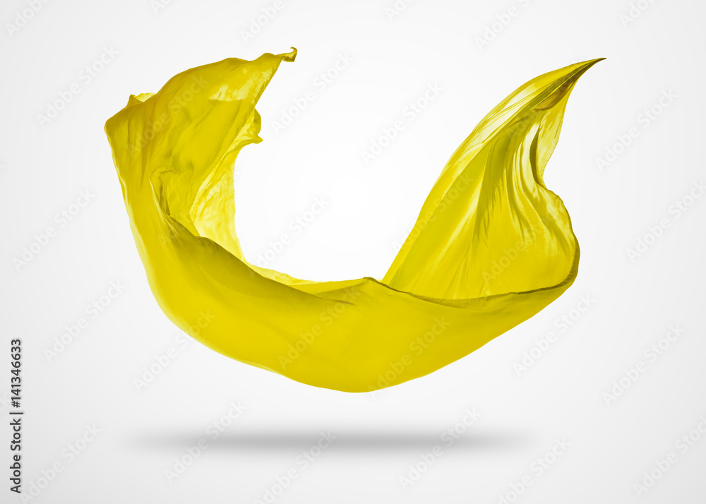 Smooth elegant yellow cloth on gray background