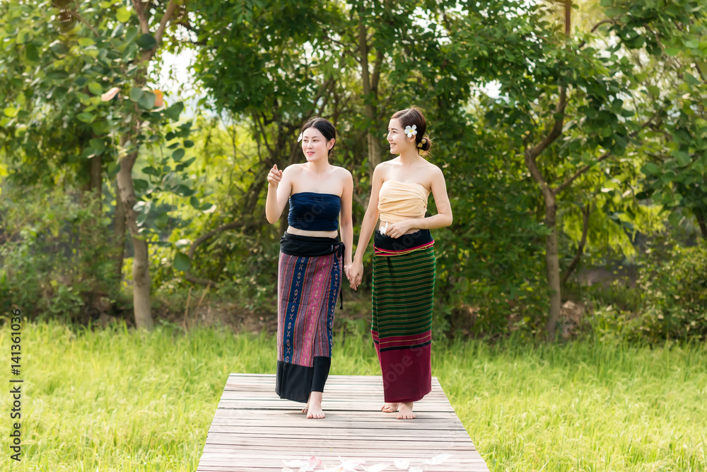 Lao women wear traditional dress at countryside.