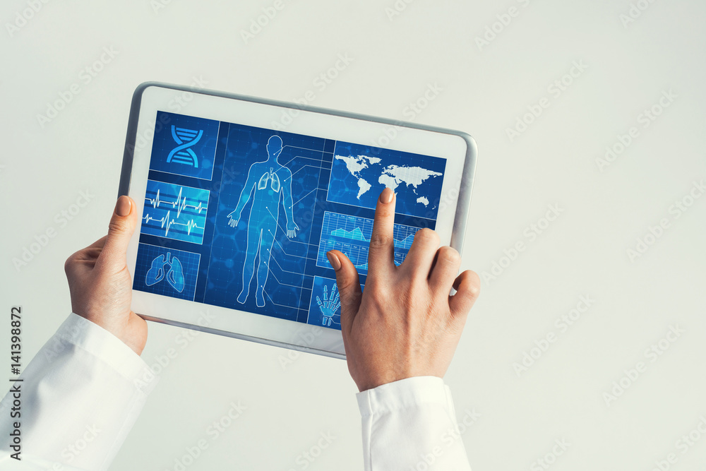 Close of female doctor hands working with tablet pc computer