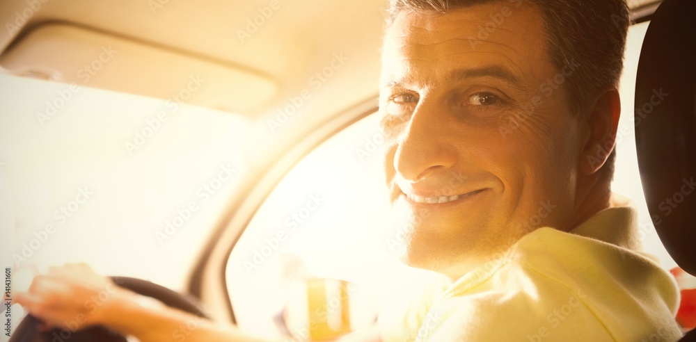 Man sitting in car at new showroom